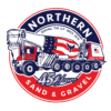 A red white and blue truck is on the side of the road.
