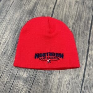 A red beanie with the northam logo on it.