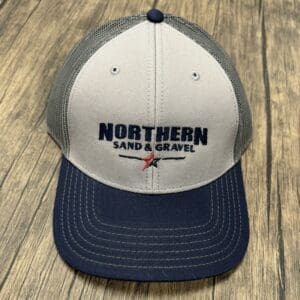 A hat that is on top of a wooden table.