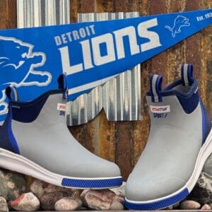 A pair of shoes sitting on top of rocks.