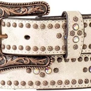 A close up of a belt with some brown and white designs