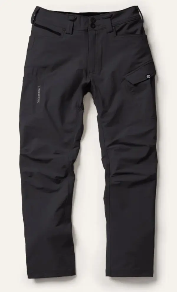 A black pair of pants hanging on the wall.