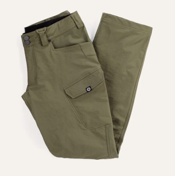 A pair of green pants sitting on top of a table.