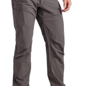 A man wearing grey pants and black shoes.