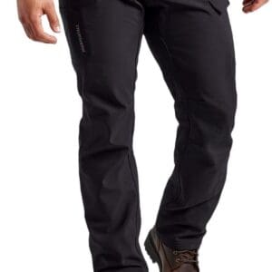 A man wearing black pants and boots