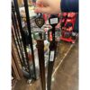 A person holding onto some poles in the store