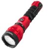 A red and black flashlight is on the floor.