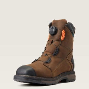 A brown work boot with an orange button.