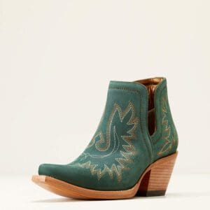 A pair of green boots with a brown heel.