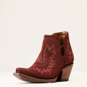 A red cowboy boot with a cut out design.