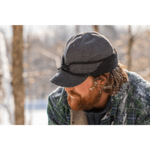 A man with long hair and beard wearing a hat.