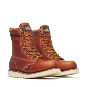 A pair of work boots that are brown and white.