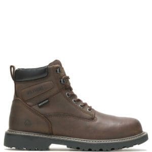 A brown work boot with black laces and a black sole.