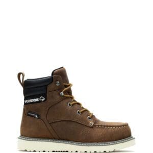 A pair of brown work boots with white soles.