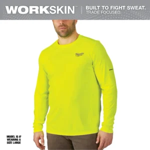 A man wearing a neon yellow shirt and pants.