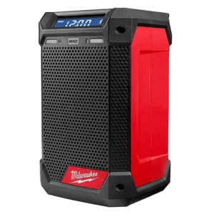 A red and black speaker is on the ground