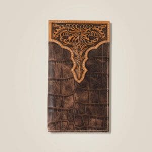 A brown wallet with a design on it.