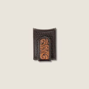 A brown leather wallet with a carved design on the front.