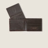 A brown wallet is open and it has a picture of the inside.