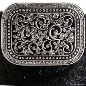 A belt buckle with a decorative design on it.