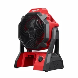 A red and black fan is sitting on the floor