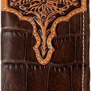 A brown wallet with an ornate design on it.