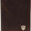 A brown wallet with a silver shield on the front.
