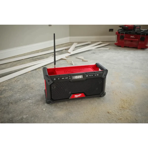 A radio sitting on the ground in a room.