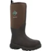 A brown and black muck boot is on the ground