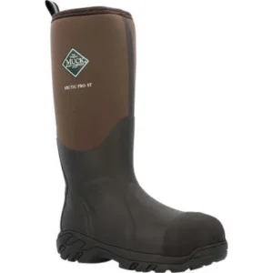A brown and black muck boot is on the ground